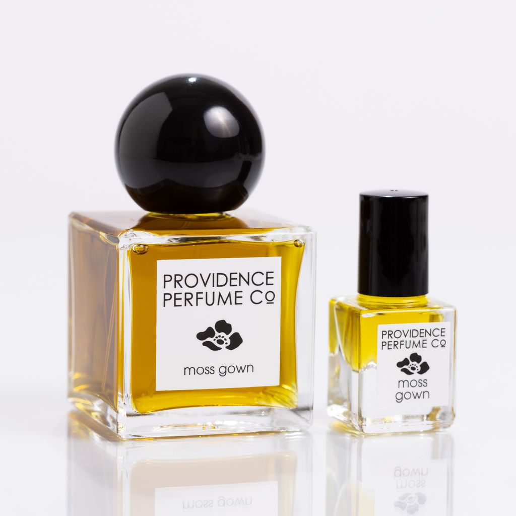 Two bottles of Providence Perfume Co. 'moss gown' on a white background