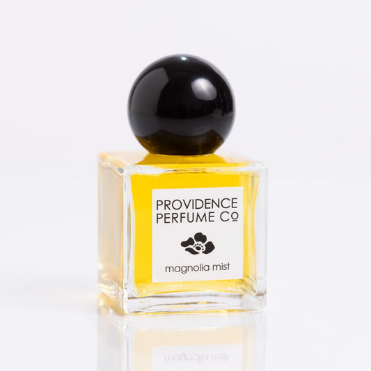 Perfume bottle labeled 'Providence Perfume Co Magnolia Mist' on a white background